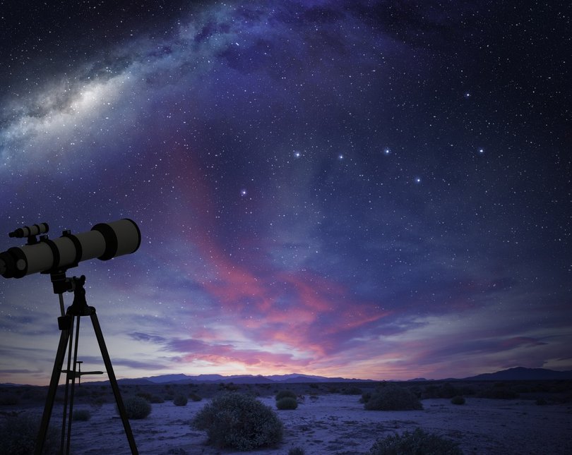 A telescope and the night sky