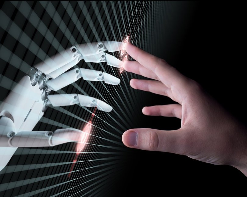 Robot and human hands touching