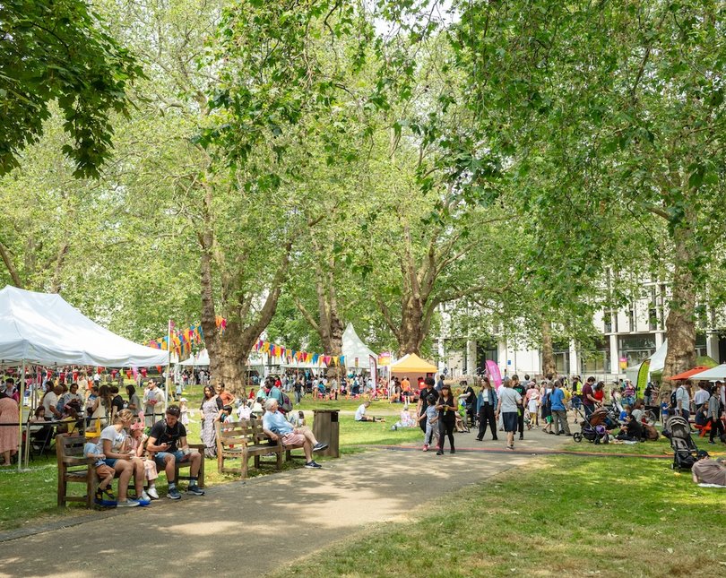 Garden with marquees and people