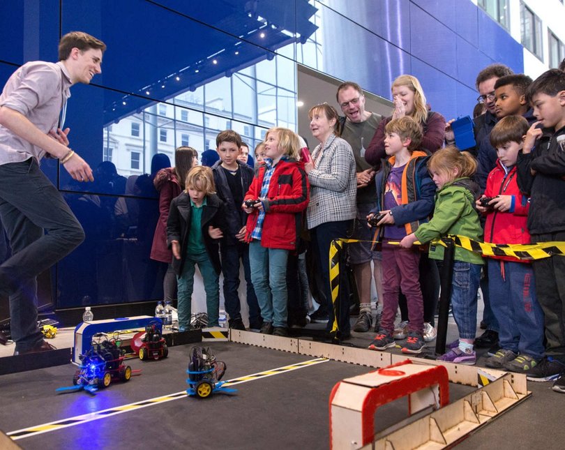 Crowd watching small robots play football