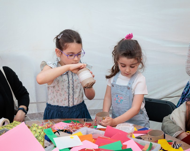 Two children making crafts