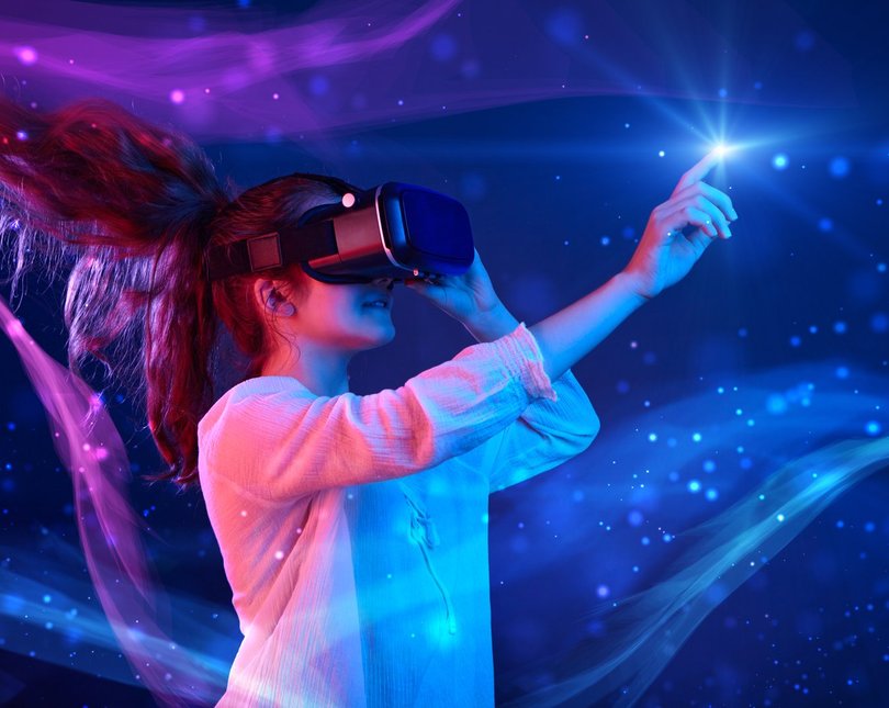 A woman with VR glasses and a pony tail flying up in the air touches a bright light against a mystical blue background