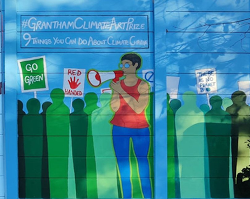 Mural of a woman with a speaker