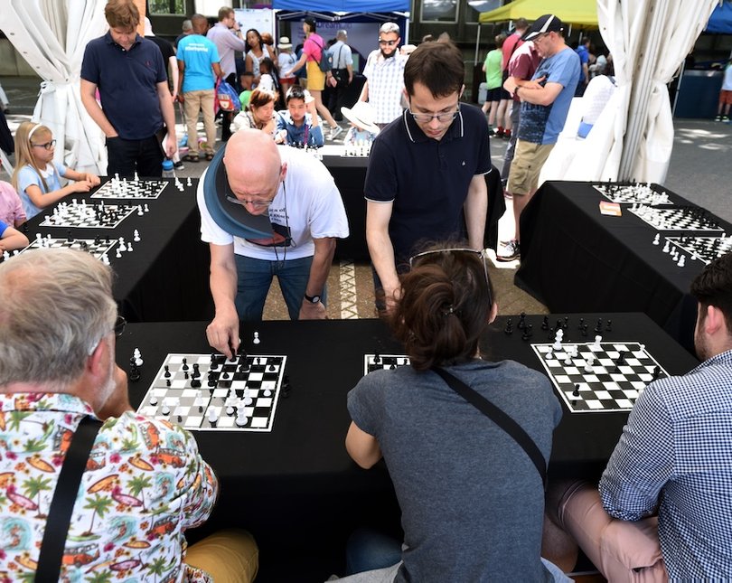 A group of people playing chess