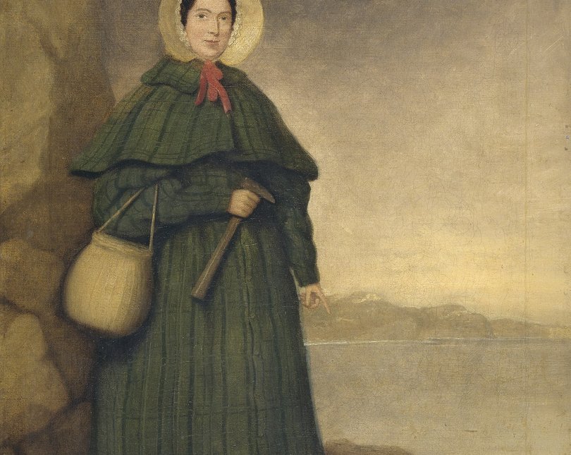 Image of palaeontologist Mary Anning with hammer and dog