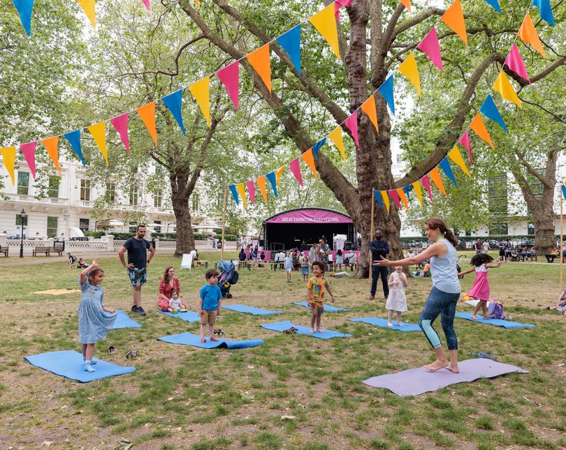 Children do yoga in Prince's Gardens