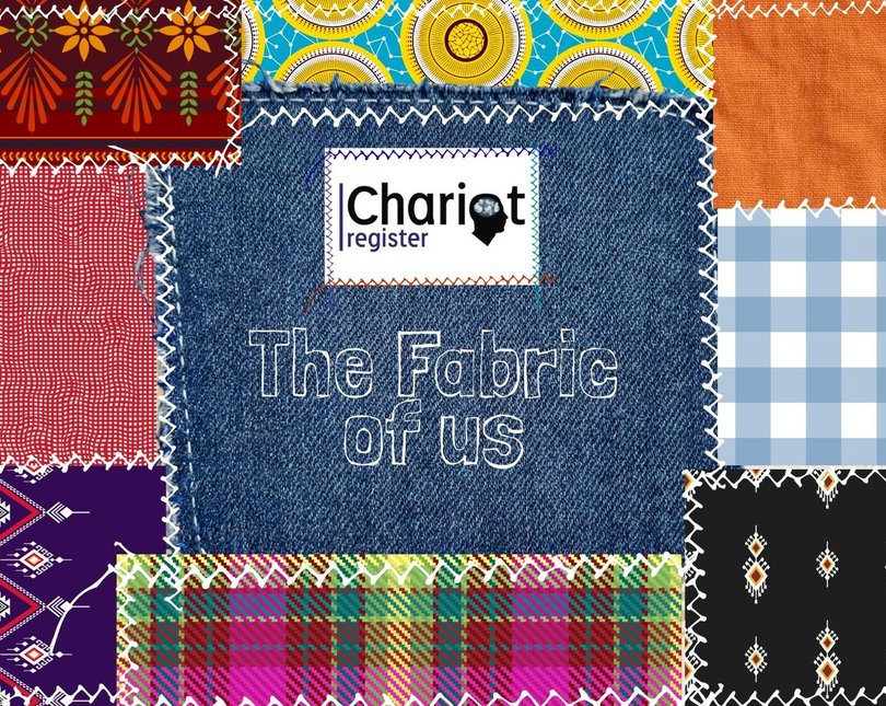 Patchwork quilt with 'The Fabric of Us' stitched into the centre