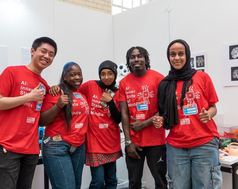 A group of five young people in red tshirts
