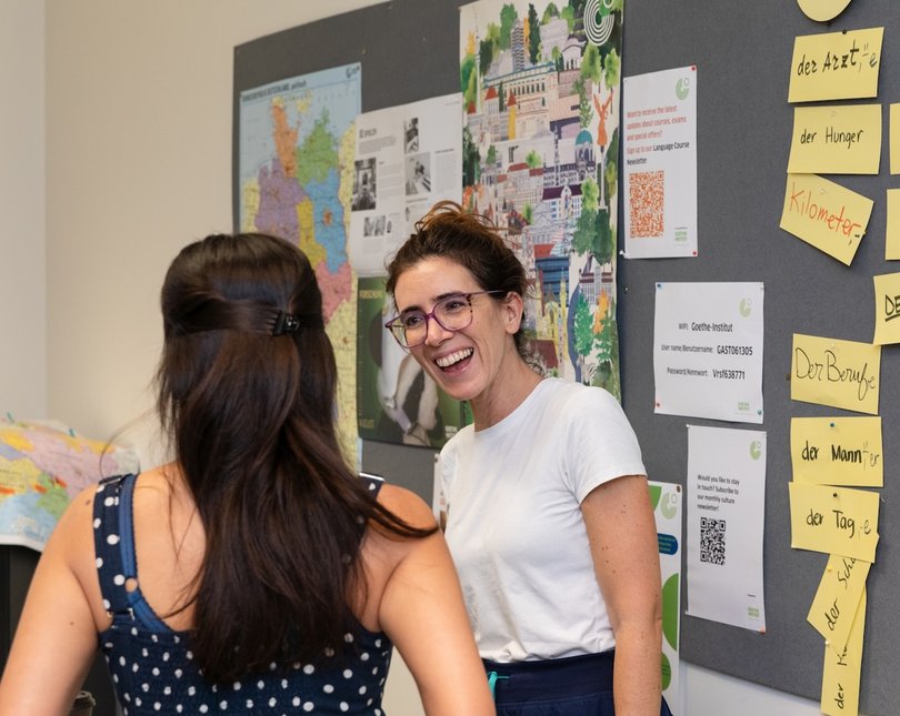 Young woman smiling in a language class