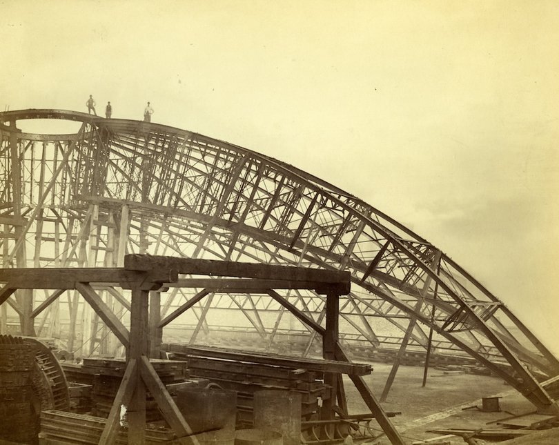 Sepia image of a domed, iron structure (the Royal Albert Hall being built)
